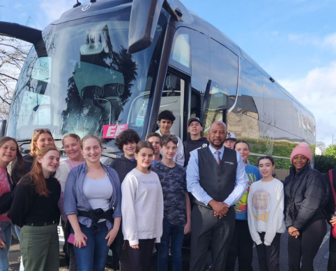 School children with coach and driver