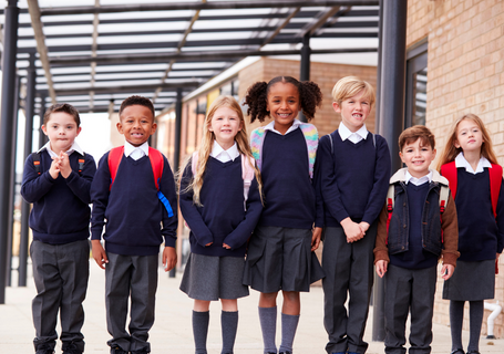 Group of school children coming out of school